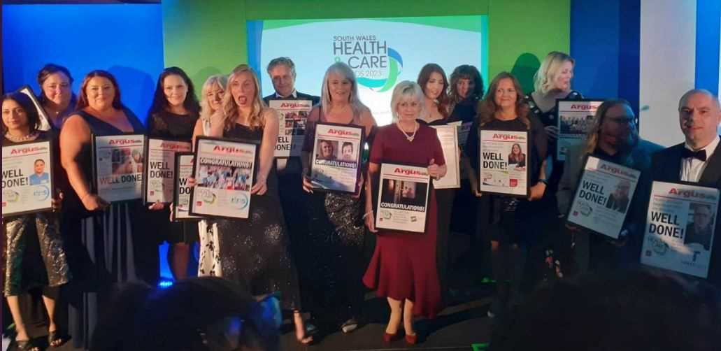 Karen Hughes (front and centre) accepting the 'Health Care Team Award' on behalf of St David's Hospice Care. 