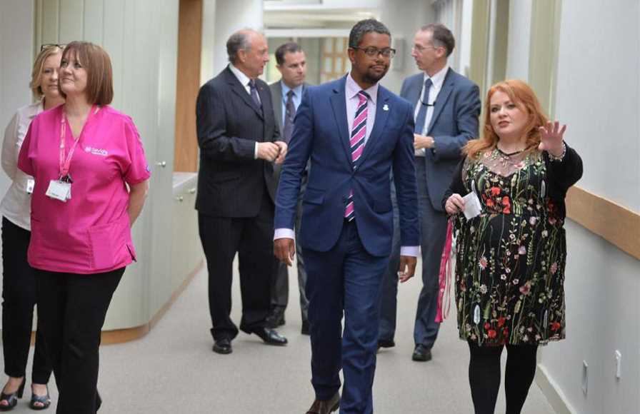 Emma Saysell shows Vaughan Gething, minister for the economy of Wales around the In Patient Unit at the opening event.